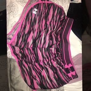 Under armor pink/black running shorts.